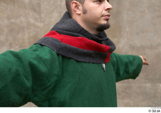  Photos Medieval Servant in suit 4 Green gambeson Medieval clothing grey red and hood medieval servant upper body 0005.jpg